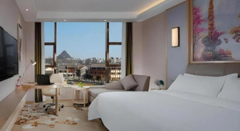 Bed in Vienna Hotel Guizhou Liupanshui Shuicheng Ancient Town