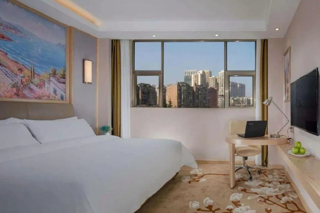 Bed in Vienna Hotel Guizhou Liupanshui Shuicheng Ancient Town