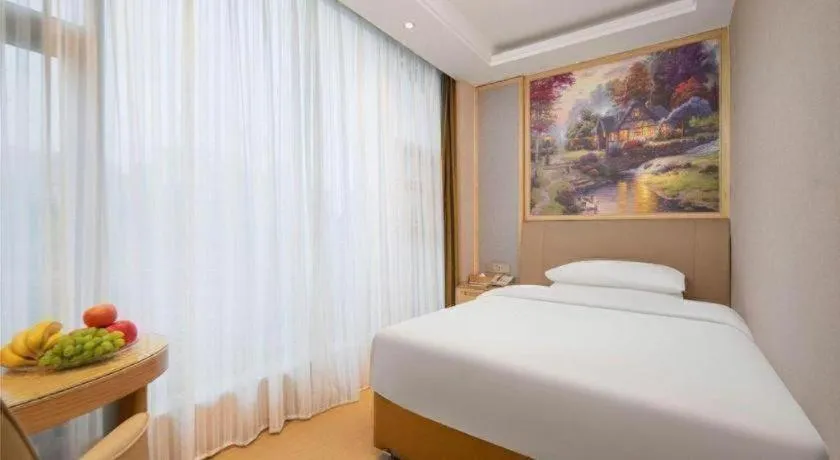 Bed in Vienna Hotel Guizhou Liupanshui Shuicheng Ancient Town