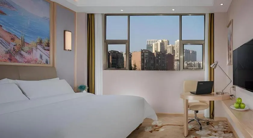 Bed in Vienna Hotel Guizhou Liupanshui Shuicheng Ancient Town