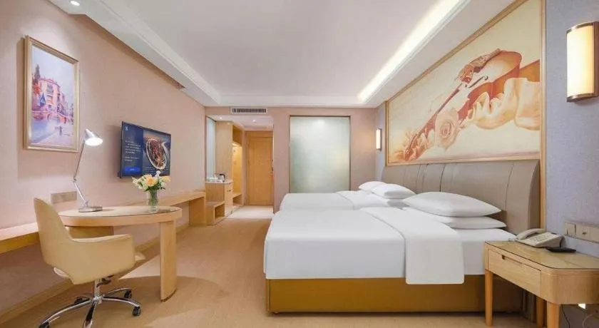 Bed in Vienna Hotel Guizhou Liupanshui Shuicheng Ancient Town