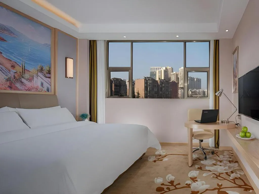 Bed in Vienna Hotel Guizhou Liupanshui Shuicheng Ancient Town