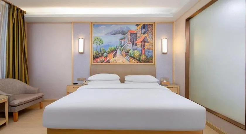 Bed in Vienna Hotel Guizhou Liupanshui Shuicheng Ancient Town