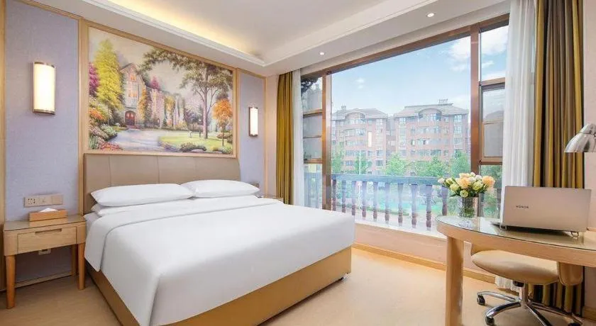 Bed in Vienna Hotel Guizhou Liupanshui Shuicheng Ancient Town