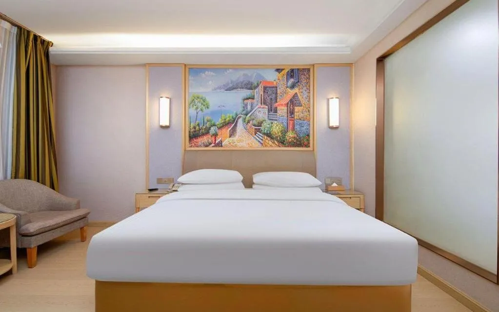 Bed in Vienna Hotel Guizhou Liupanshui Shuicheng Ancient Town