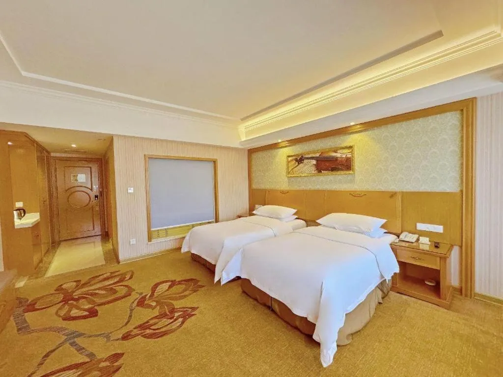 Bed in Vienna Hotel Guangxi Guilin Xing'an