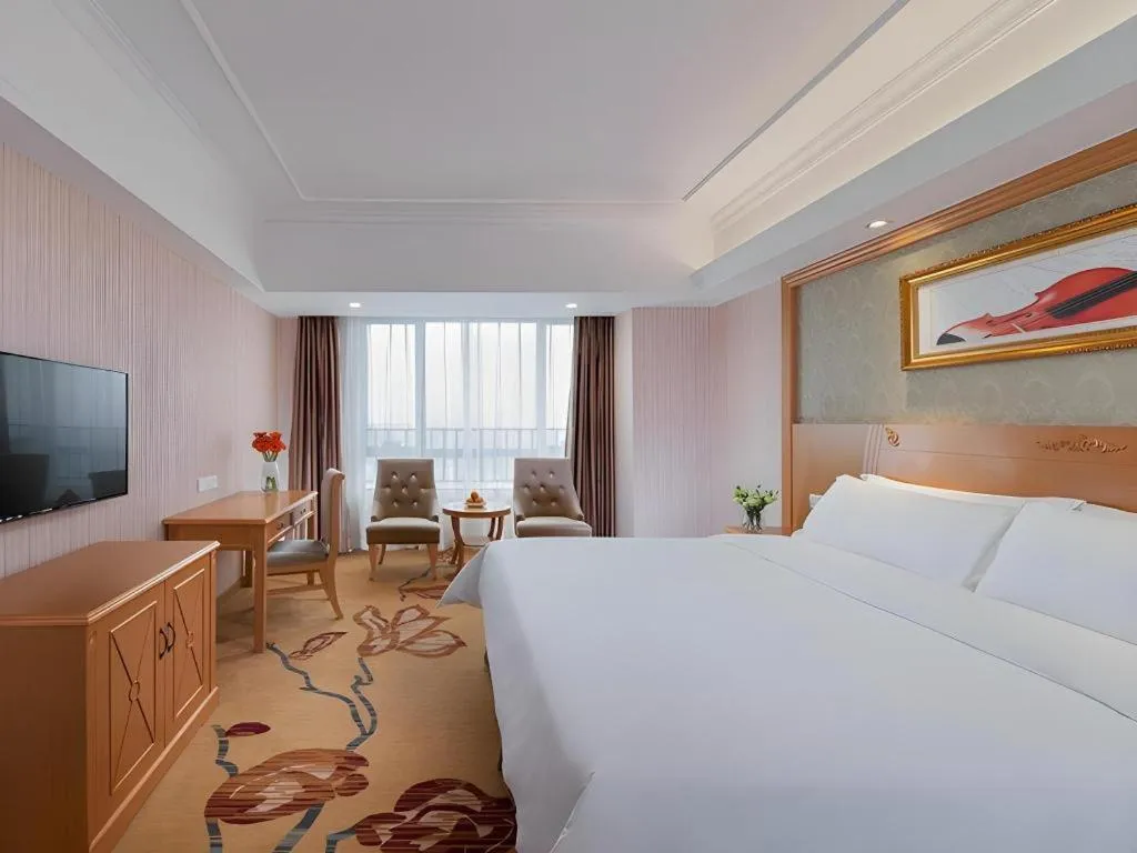 Bed in Vienna Hotel Guangxi Guilin Xing'an