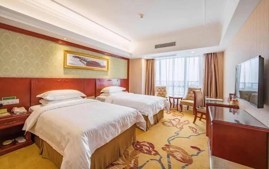 Bed in Vienna Hotel Guangxi Guilin Xing'an