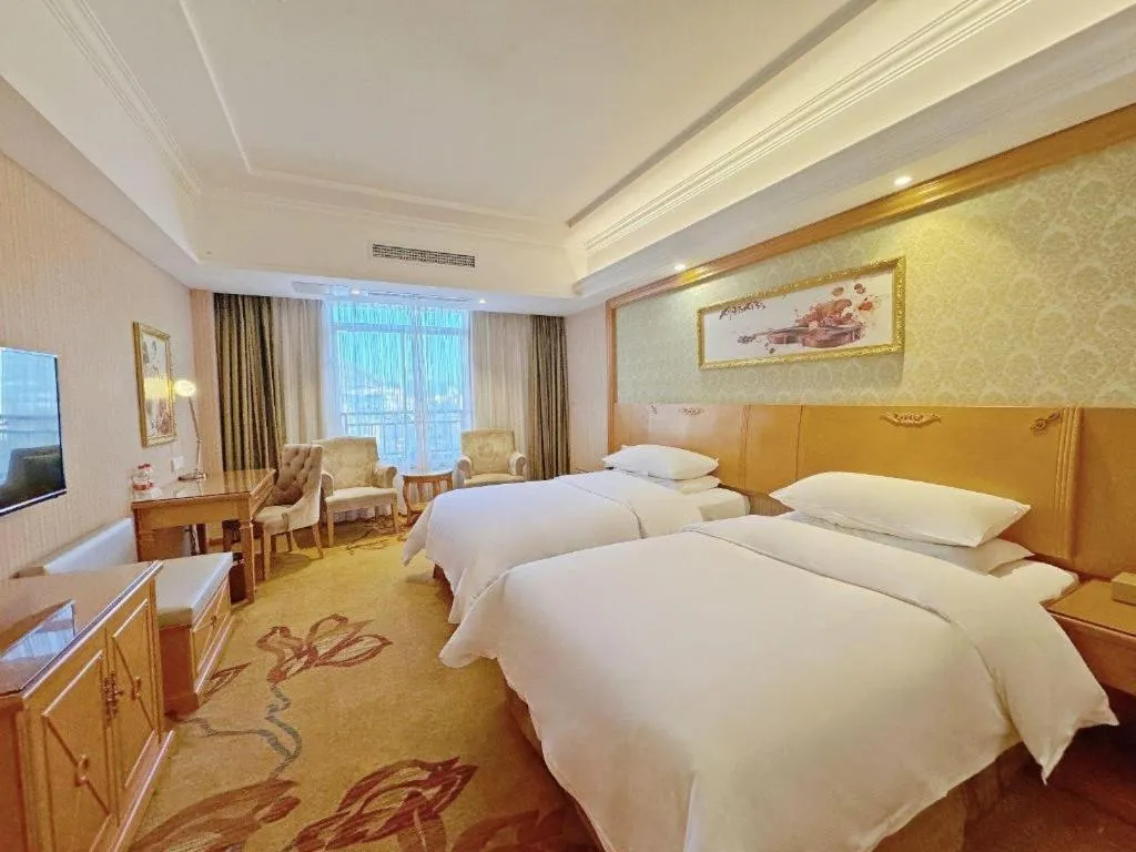 Bed in Vienna Hotel Guangxi Guilin Xing'an