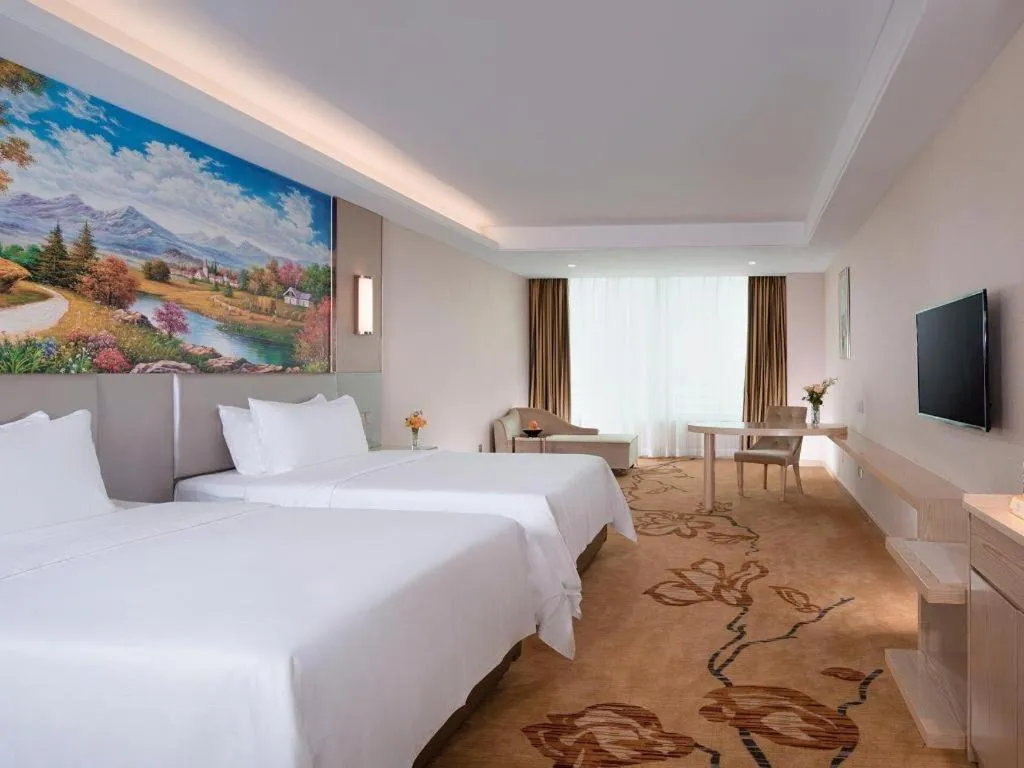 Bed in Vienna Hotel Guangdong Huizhou High-Speed North Railway Station Xiaojinkou