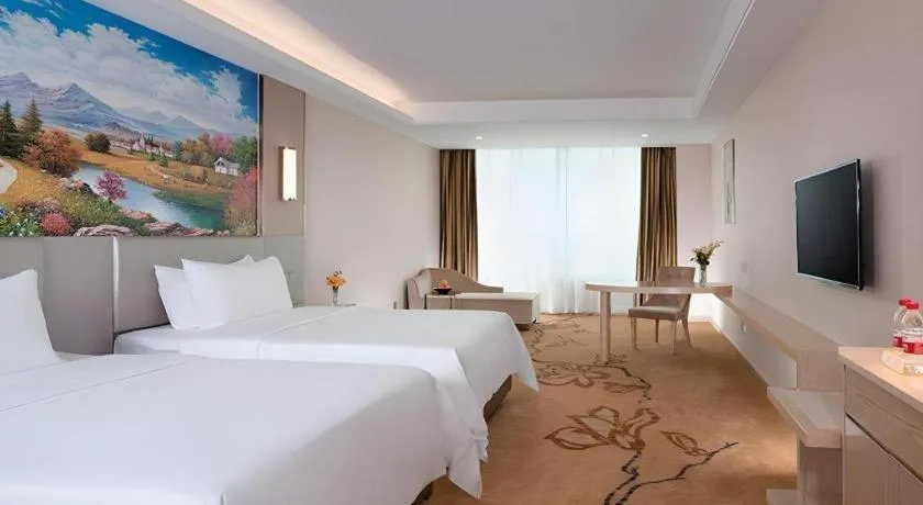 Bed in Vienna Hotel Guangdong Huizhou High-Speed North Railway Station Xiaojinkou
