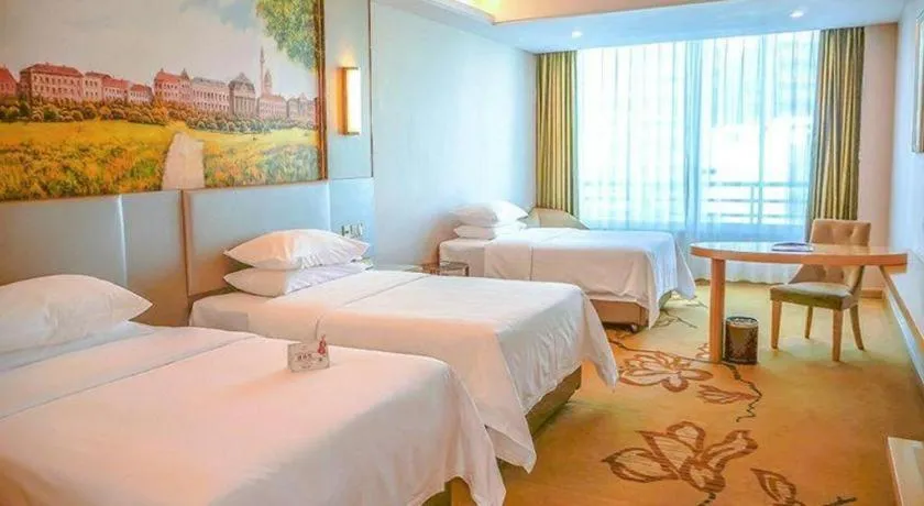 Bed in Vienna Hotel Guangdong Huizhou High-Speed North Railway Station Xiaojinkou