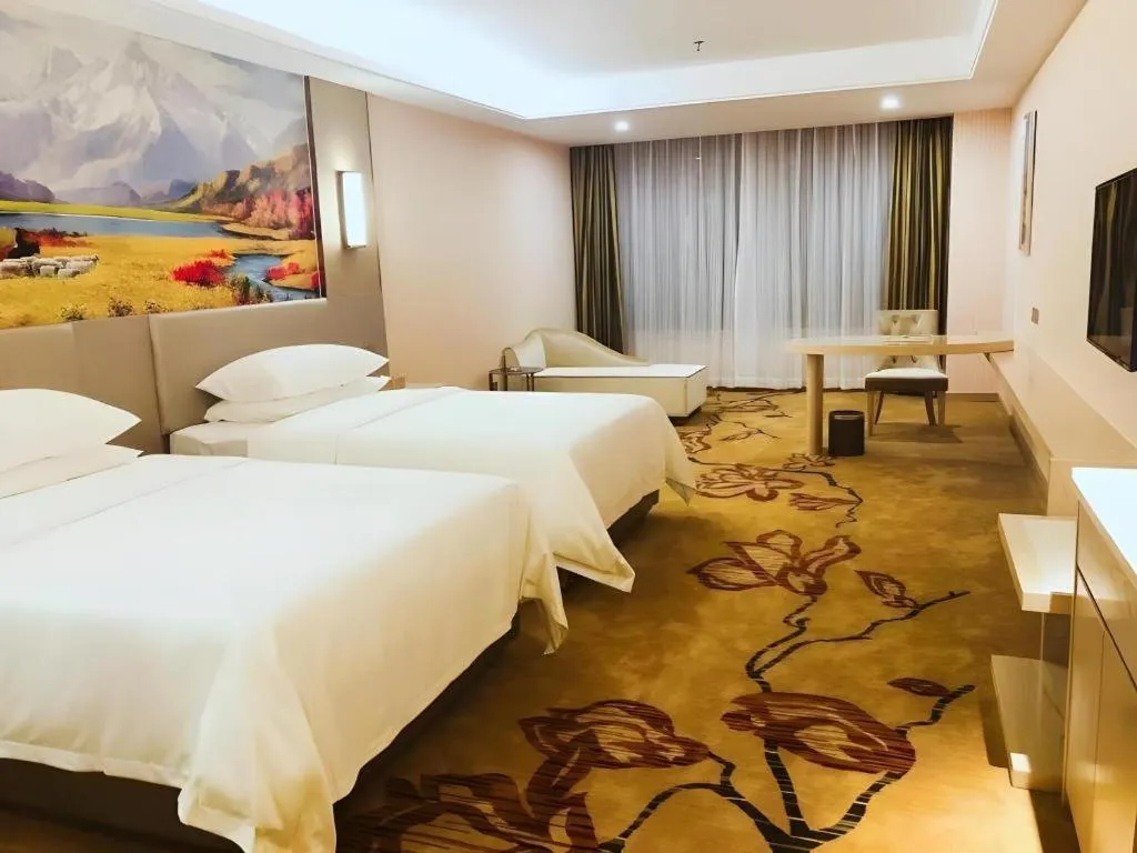 Bed in Vienna Hotel Guangdong Huizhou High-Speed North Railway Station Xiaojinkou