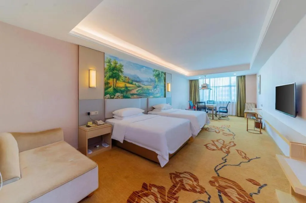 Bed in Vienna Hotel Guangdong Huizhou High-Speed North Railway Station Xiaojinkou
