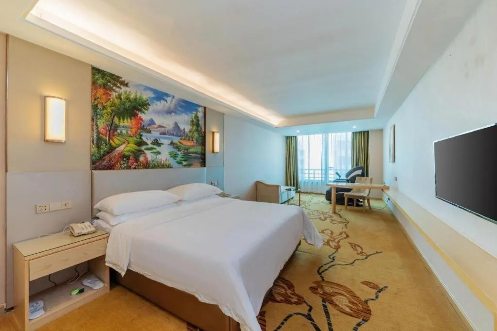 Bed in Vienna Hotel Guangdong Huizhou High-Speed North Railway Station Xiaojinkou