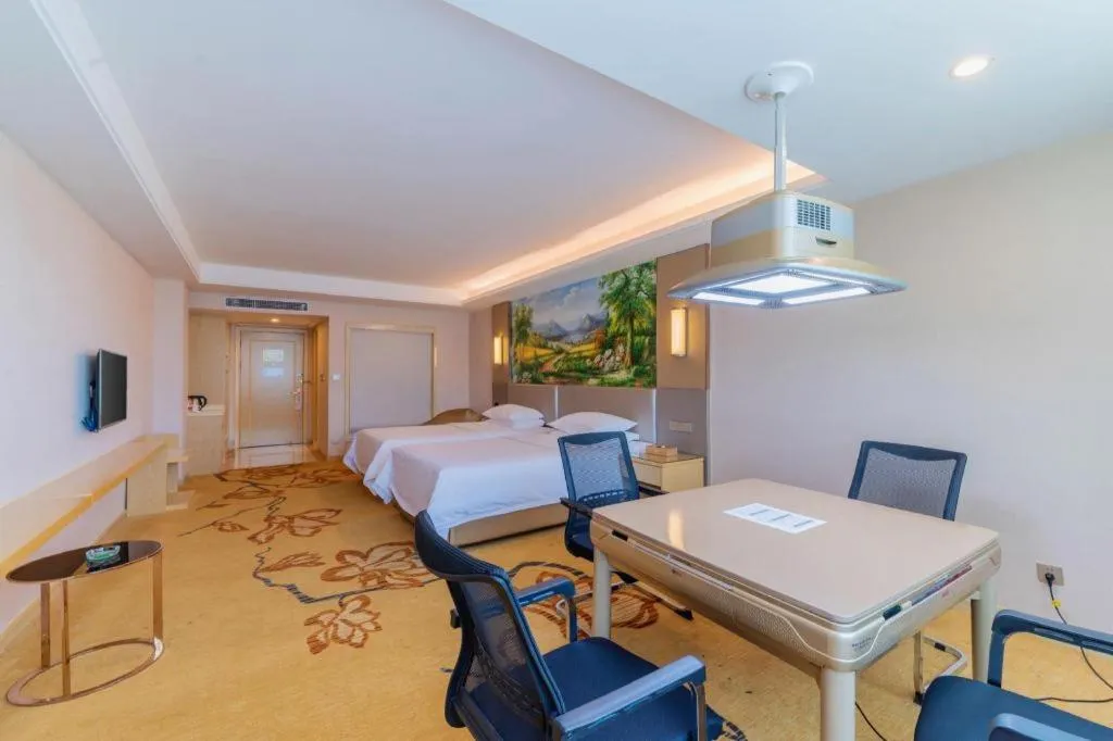 Bed in Vienna Hotel Guangdong Huizhou High-Speed North Railway Station Xiaojinkou