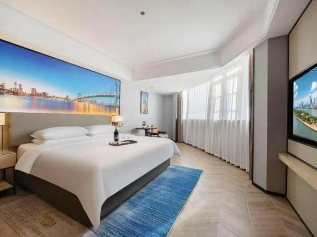 Bed in Vienna Hotel Yongzhou Dong'an High-Speed Railway Station