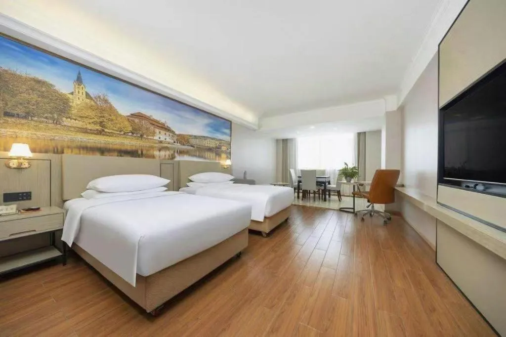 Bed in Vienna Hotel Yongzhou Dong'an High-Speed Railway Station