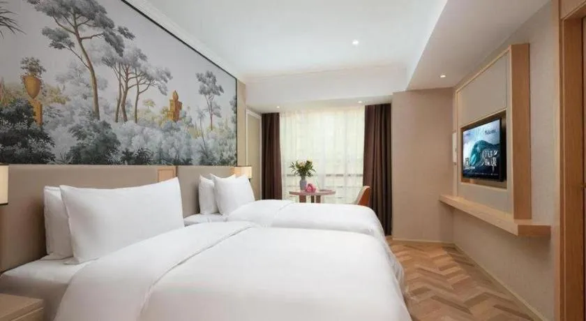 Bed in Vienna Hotel Yongzhou Dong'an High-Speed Railway Station