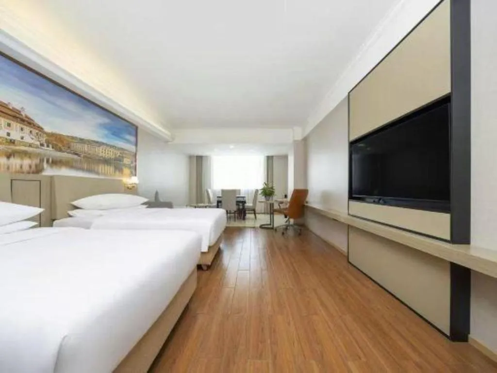 Bed in Vienna Hotel Yongzhou Dong'an High-Speed Railway Station