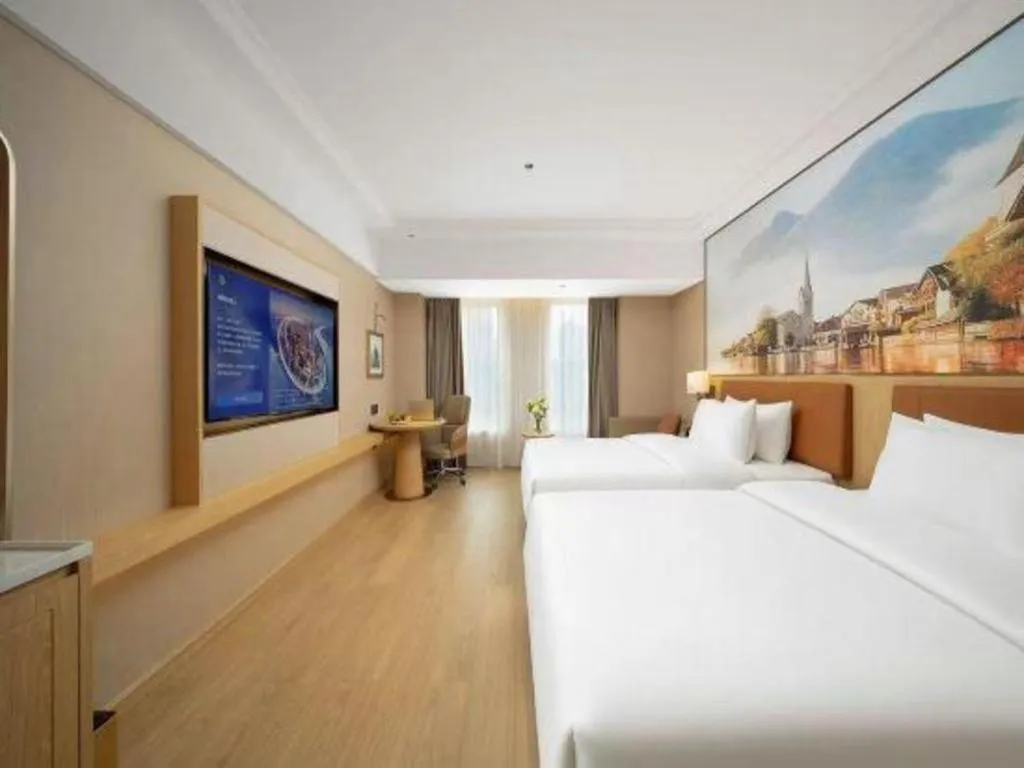 Bed in Vienna Hotel Yongzhou Dong'an High-Speed Railway Station