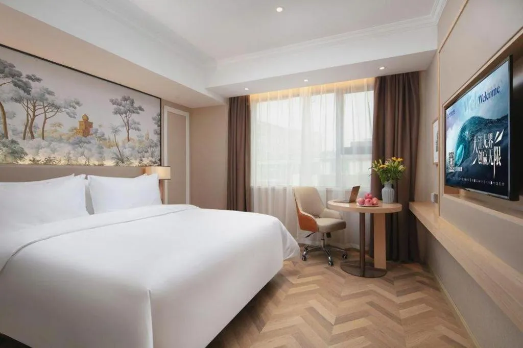 Bed in Vienna Hotel Yongzhou Dong'an High-Speed Railway Station