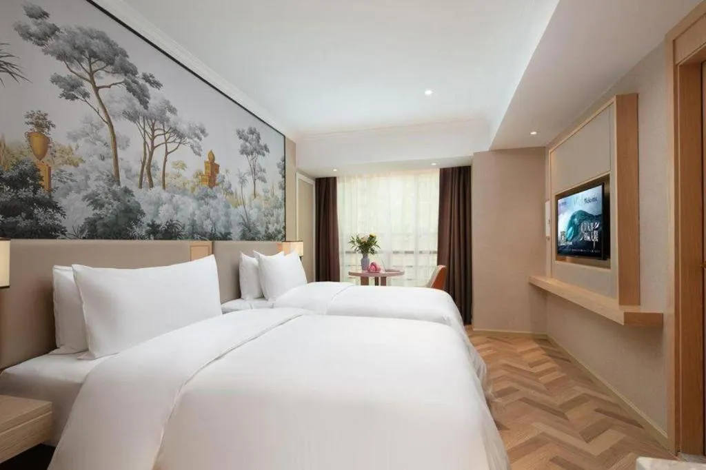 Bed in Vienna Hotel Yongzhou Dong'an High-Speed Railway Station