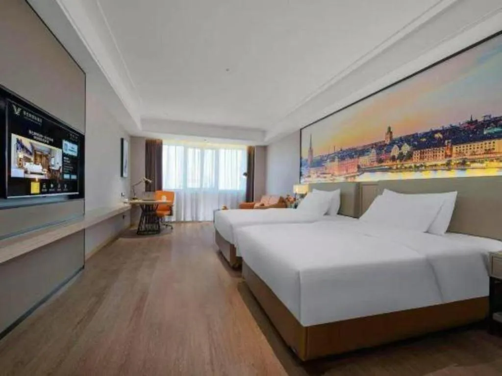 Bed in Vienna Hotel Yongzhou Dong'an High-Speed Railway Station