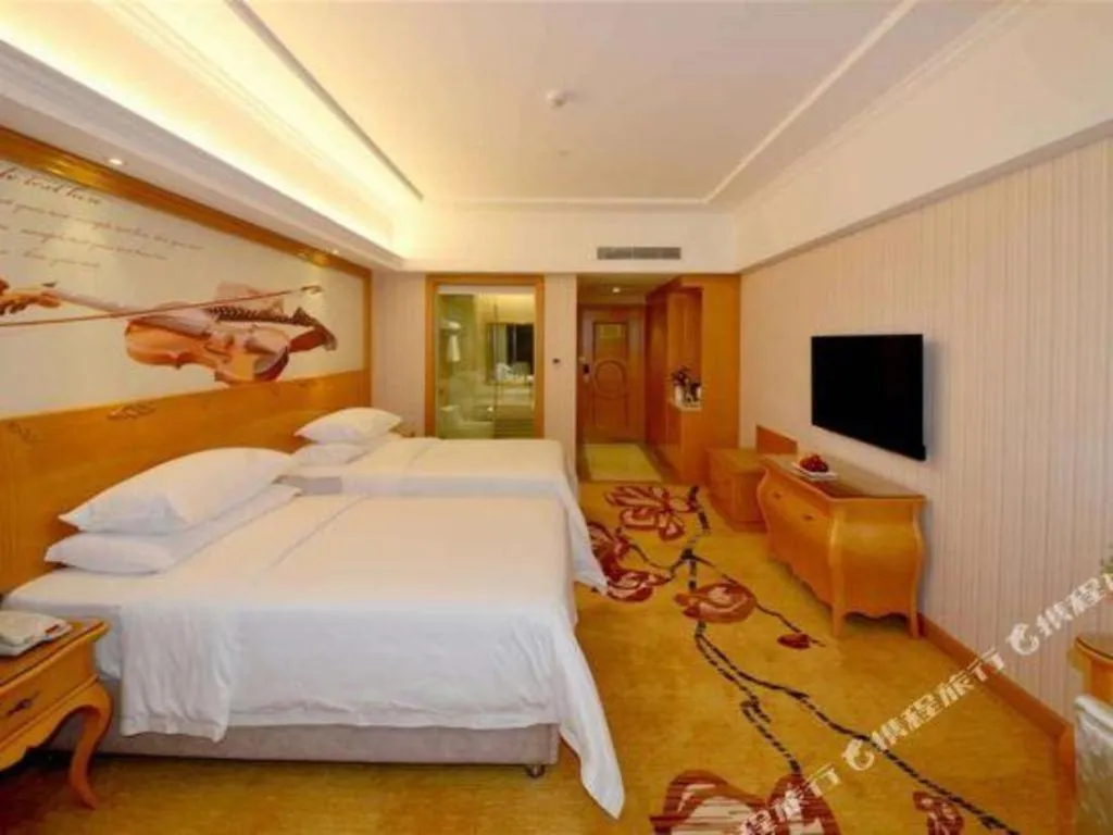 Bed in Vienna Hotel Henan Luoyang Jiudu Road Wanda