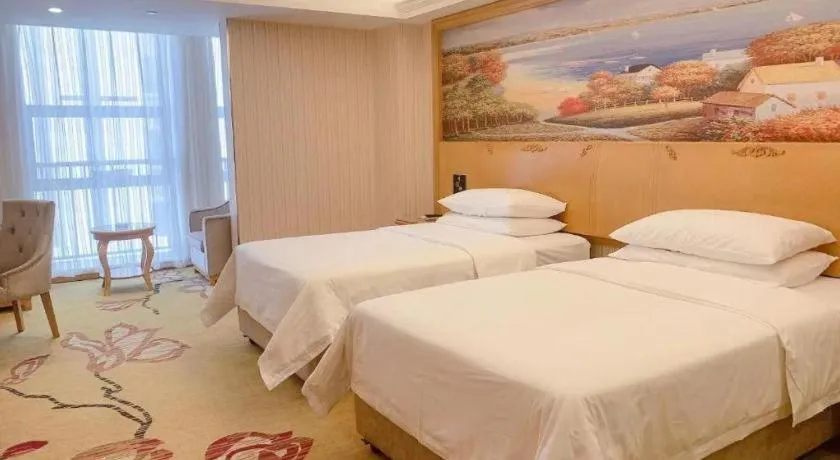 Bed in Vienna Hotel Henan Luoyang Jiudu Road Wanda