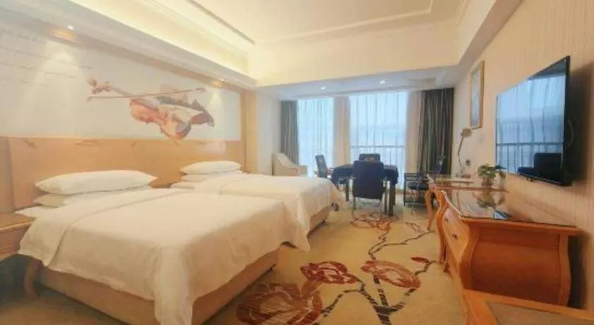 Bed in Vienna Hotel Henan Luoyang Jiudu Road Wanda