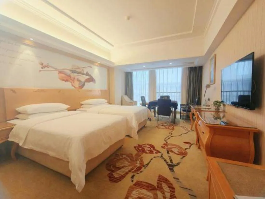 Bed in Vienna Hotel Henan Luoyang Jiudu Road Wanda