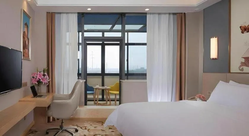 Bed in Vienna Hotel Jiangsu Zhangjiagang Passenger Terminal Station