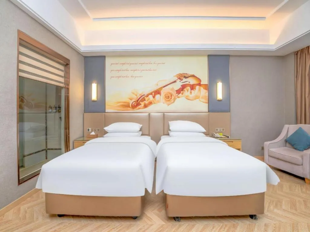 Bed in Vienna Hotel Jiangsu Zhangjiagang Passenger Terminal Station