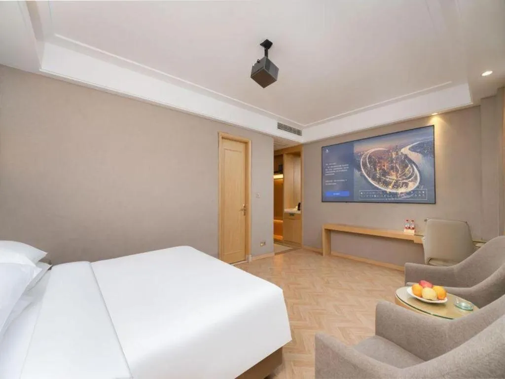 Bed in Vienna Hotel Jiangsu Zhangjiagang Passenger Terminal Station