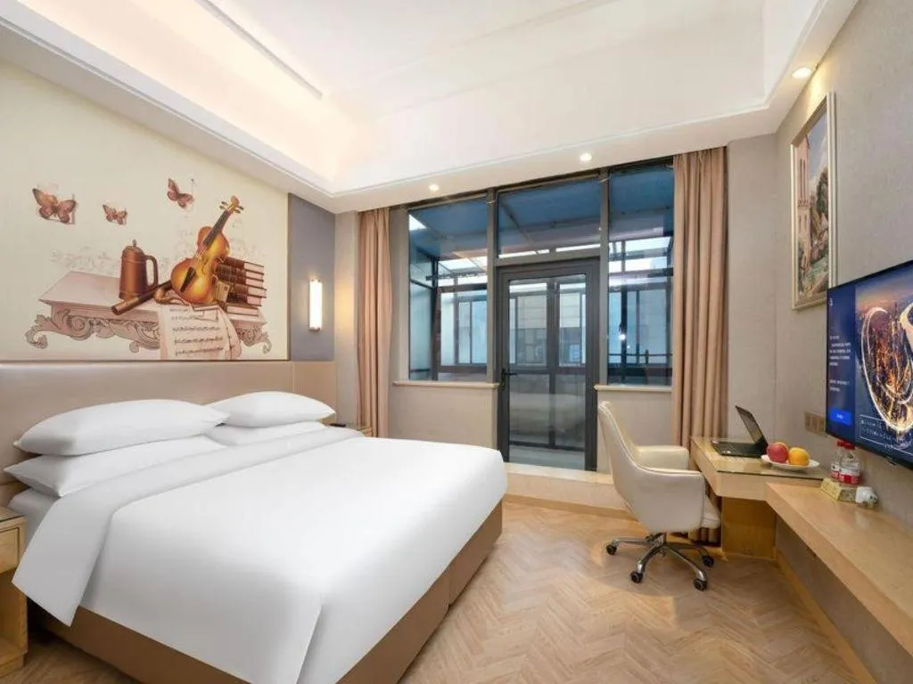 Bed in Vienna Hotel Jiangsu Zhangjiagang Passenger Terminal Station