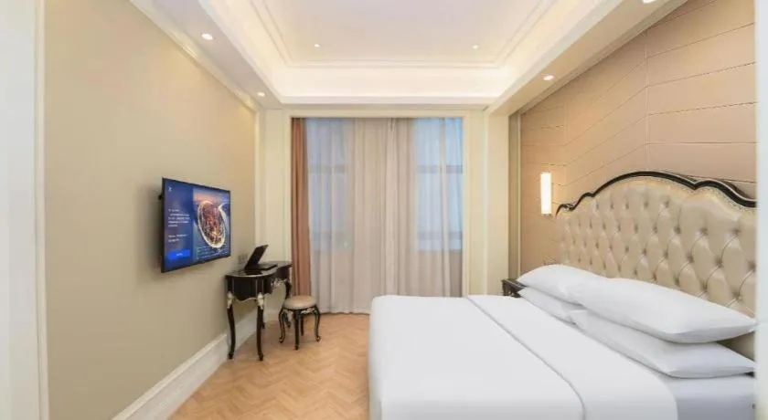 Bed in Vienna Hotel Jiangsu Zhangjiagang Passenger Terminal Station