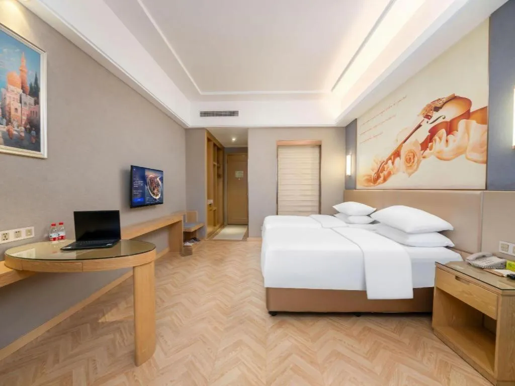 Bed in Vienna Hotel Jiangsu Zhangjiagang Passenger Terminal Station