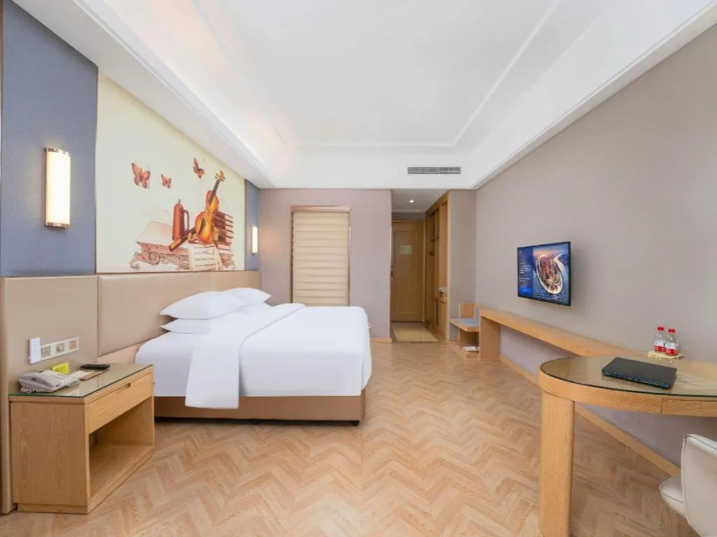 Bed in Vienna Hotel Jiangsu Zhangjiagang Passenger Terminal Station