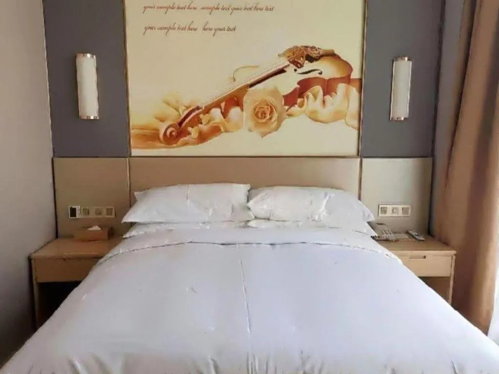 Bed in Vienna Hotel Jiangsu Zhangjiagang Passenger Terminal Station