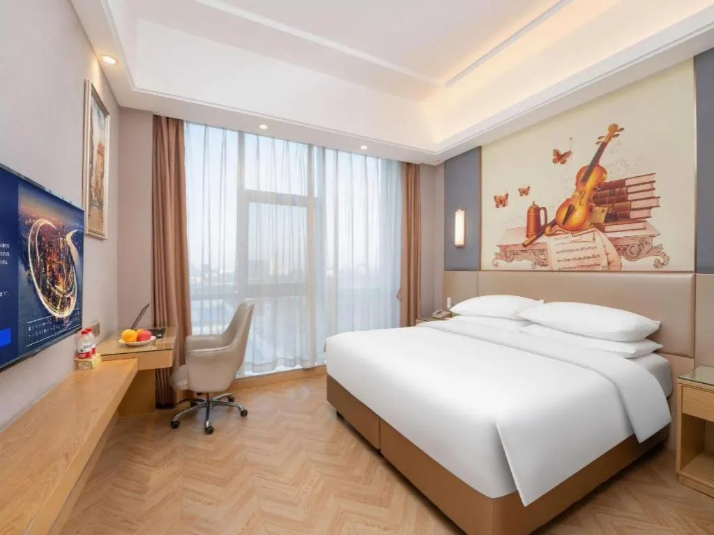 Bed in Vienna Hotel Jiangsu Zhangjiagang Passenger Terminal Station