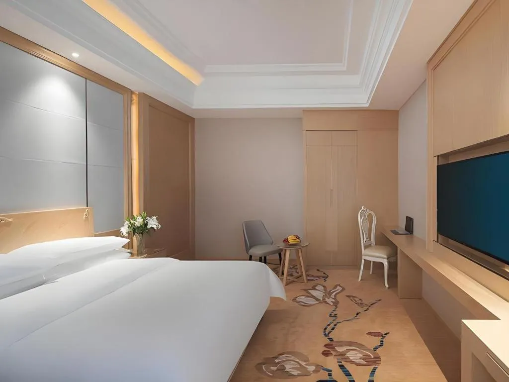 Bed in Vienna Hotel Jiangsu Kunshan Qiandeng Town