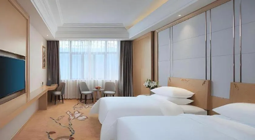 Bed in Vienna Hotel Jiangsu Kunshan Qiandeng Town