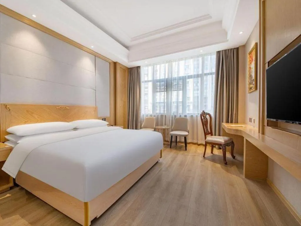 Bed in Vienna Hotel Jiangsu Kunshan Qiandeng Town