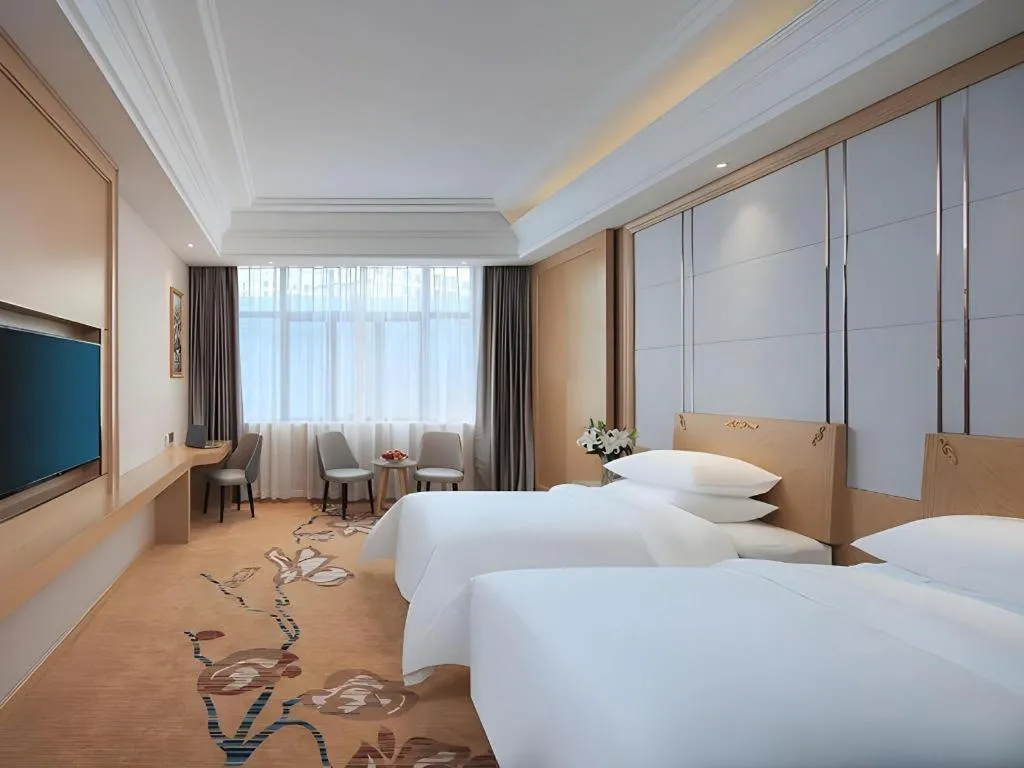 Bed in Vienna Hotel Jiangsu Kunshan Qiandeng Town
