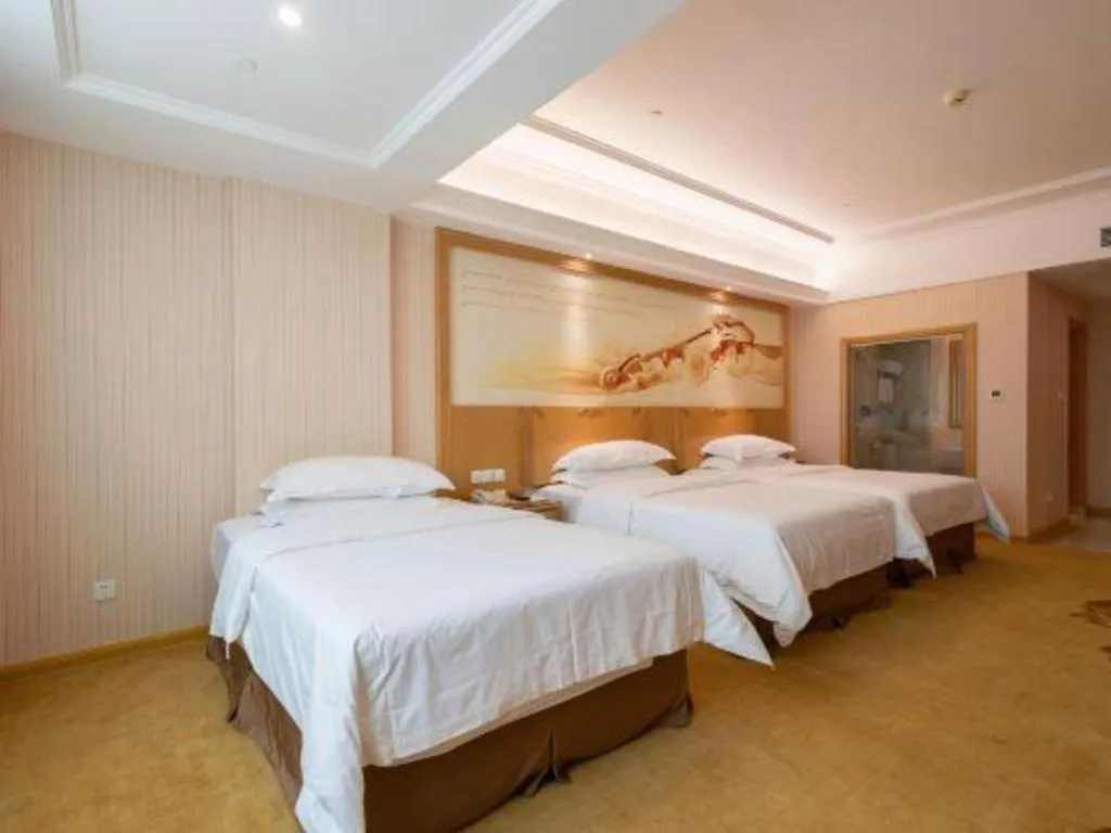 Bed in Vienna Hotel Guangzhou Huadu Sunac Cultural Tourism City Shiling