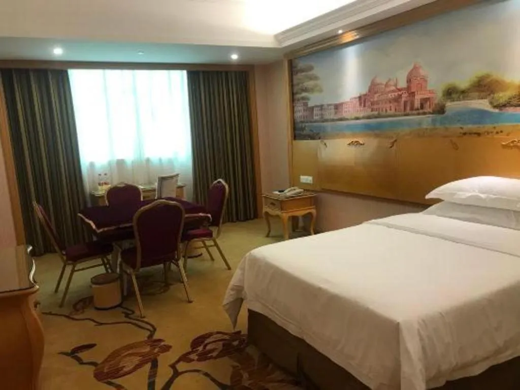 Bed in Vienna Hotel Guangzhou Huadu Sunac Cultural Tourism City Shiling