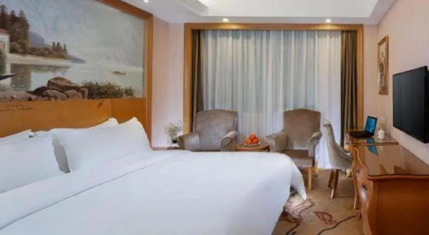 Bed in Vienna Hotel Guangzhou Huadu Sunac Cultural Tourism City Shiling