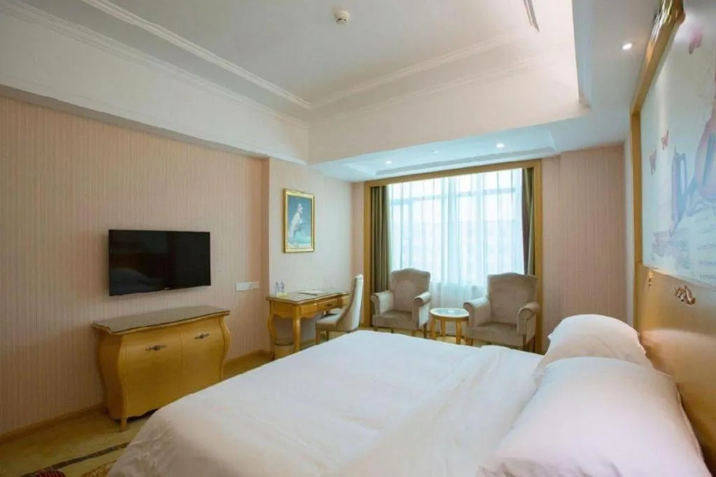 Bed in Vienna Hotel Guangzhou Huadu Sunac Cultural Tourism City Shiling