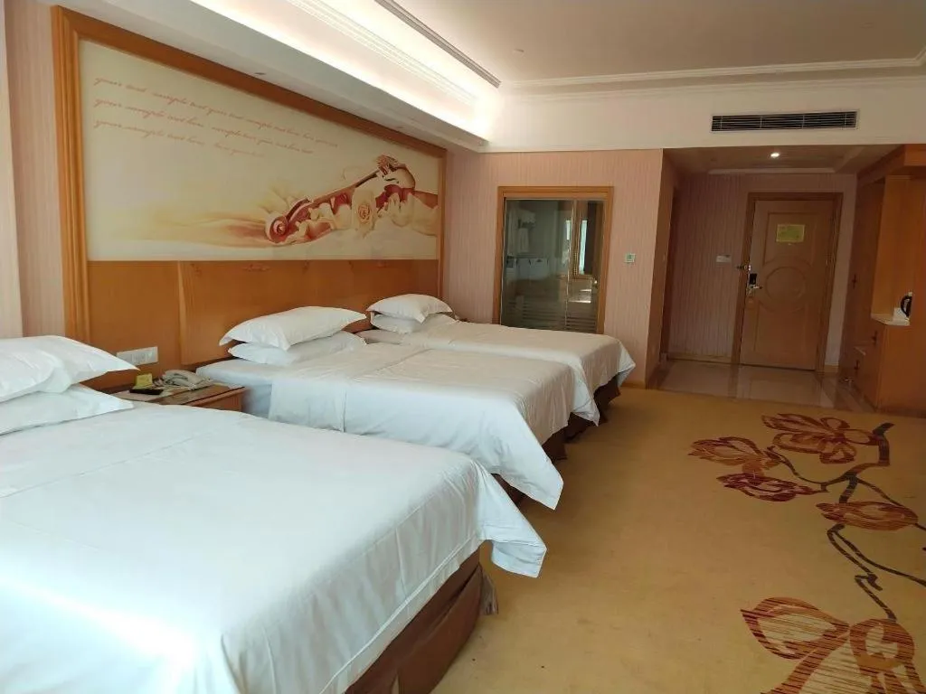 Bed in Vienna Hotel Guangzhou Huadu Sunac Cultural Tourism City Shiling